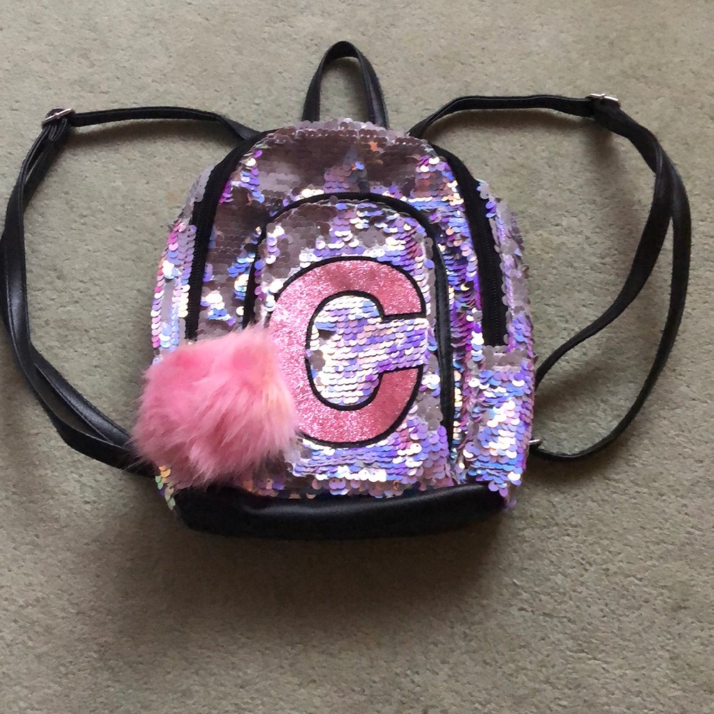 Mini Justice flip sequin backpack.